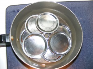 mason jar lids in hot water