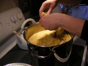 dropping dumplings into broth