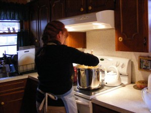 Momma stirring chicken and dumplings