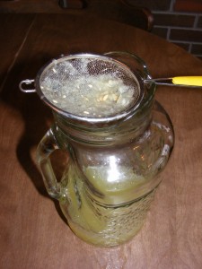 straining lemonade